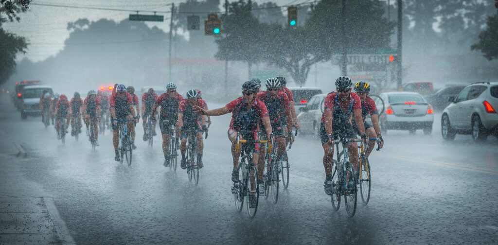 The riders tough it out even in pouring rain.