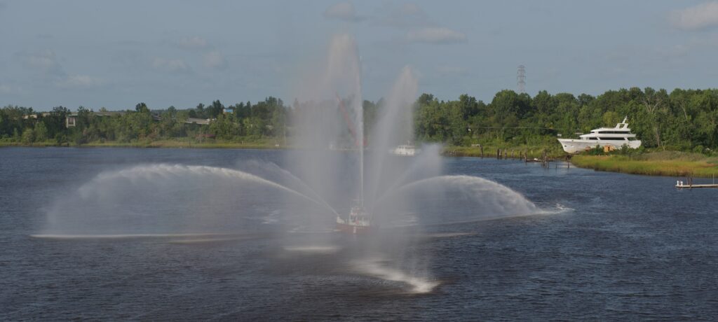 A fire boat sprays water from the lake.