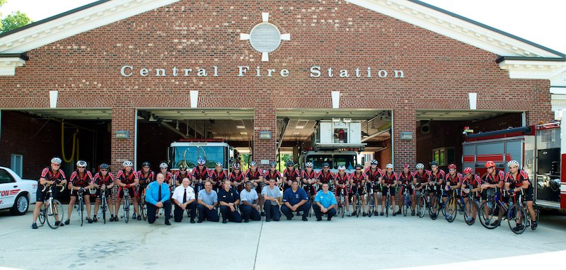 The riders outside of the fire department.