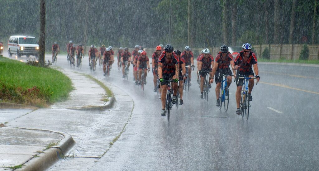 The riders determined and riding through pouring rain.